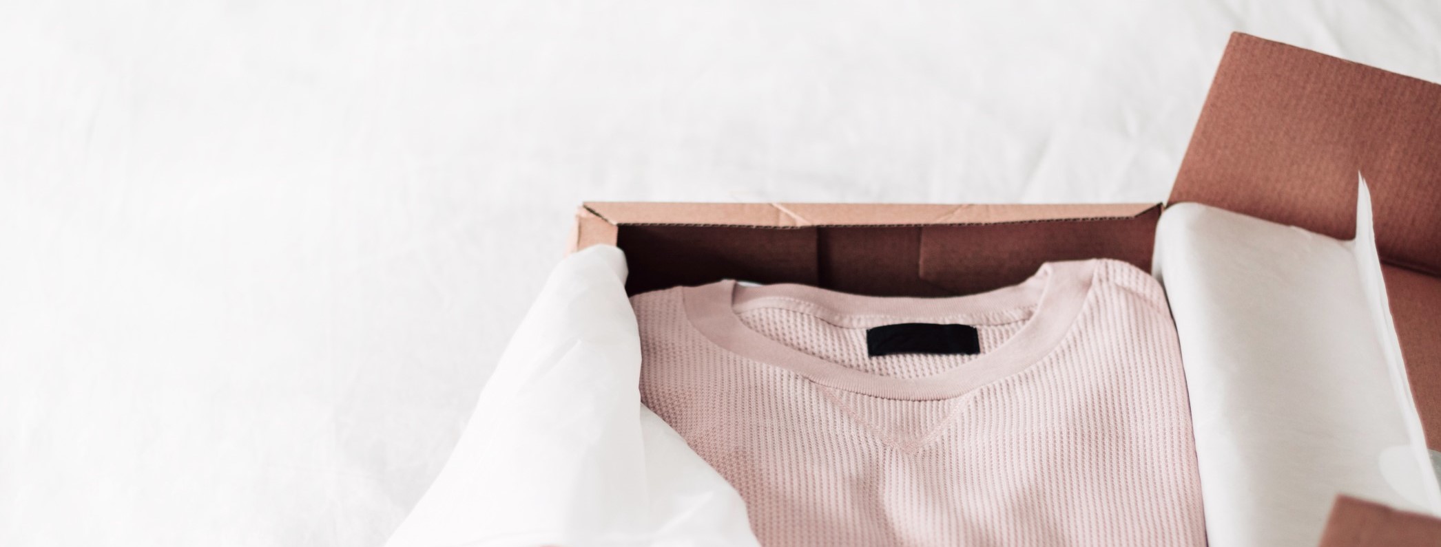 warehouse packaging example - clothes in box with tissue paper